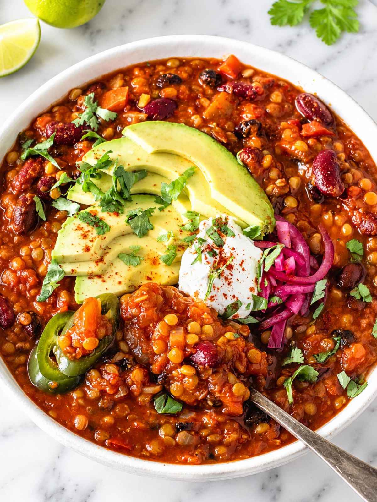 Close-up of thick lentil chili with tender beans and lentils.