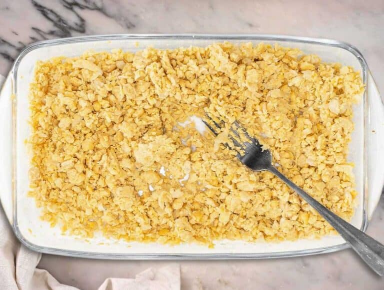 Mashed chickpeas in a container.