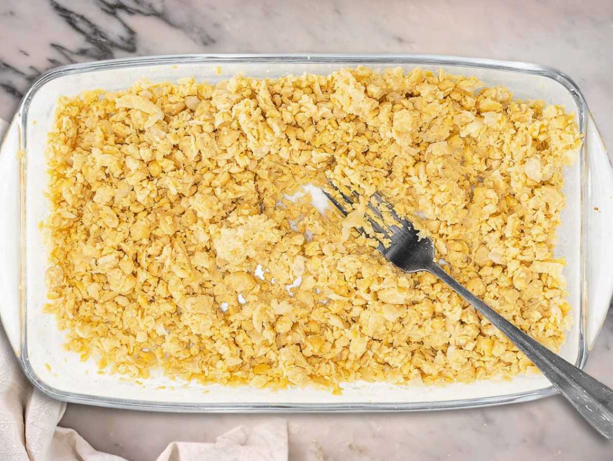 Mashed chickpeas in a container.