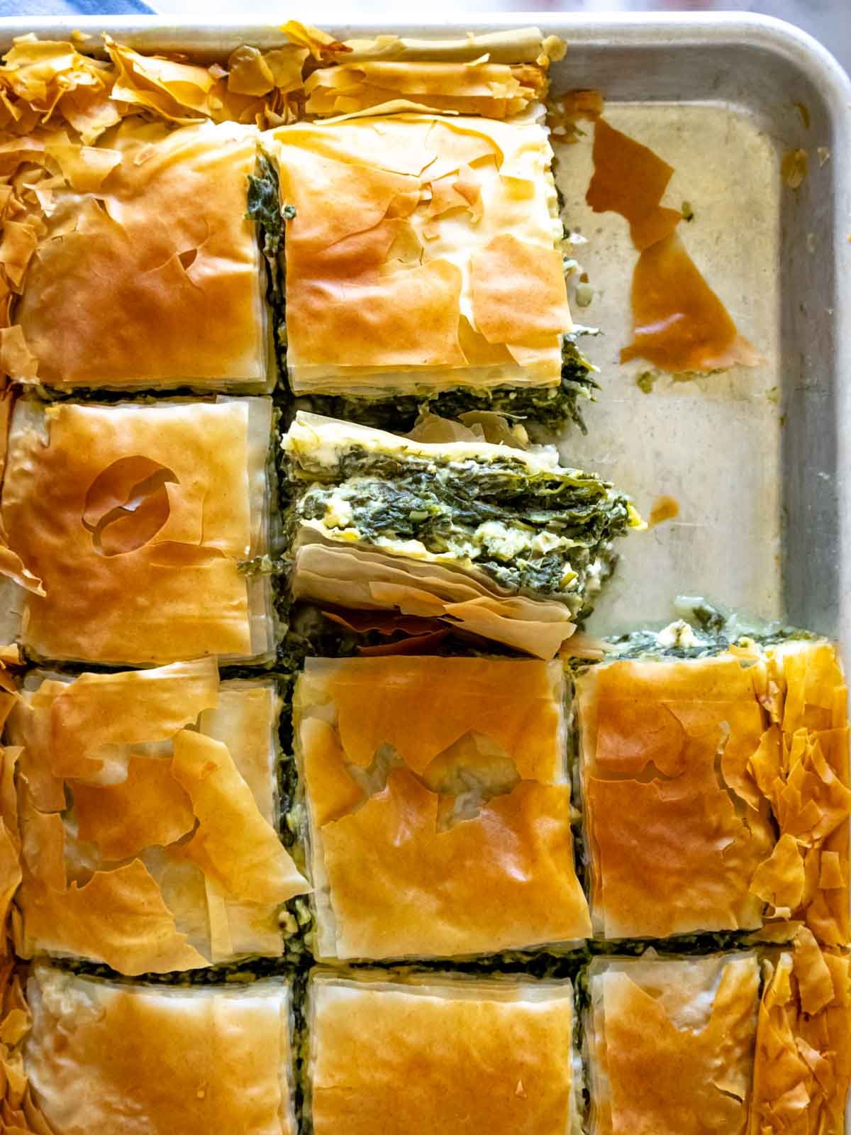 Spanakopita on a baking tray.