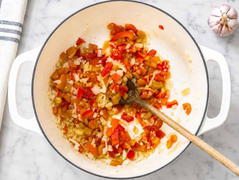 Step 1 Onion and red bell pepper softening in olive oil with garlic.