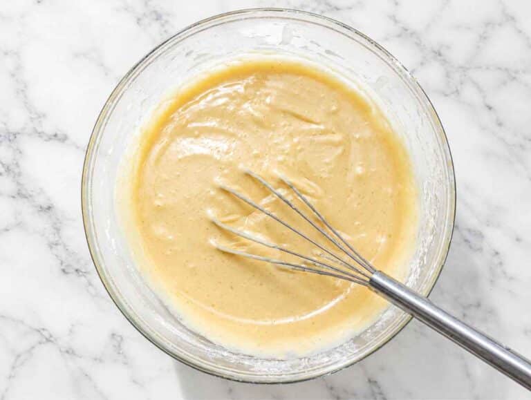 Step 1 Wet ingredients whisked with flour and baking powder for apple cake batter.