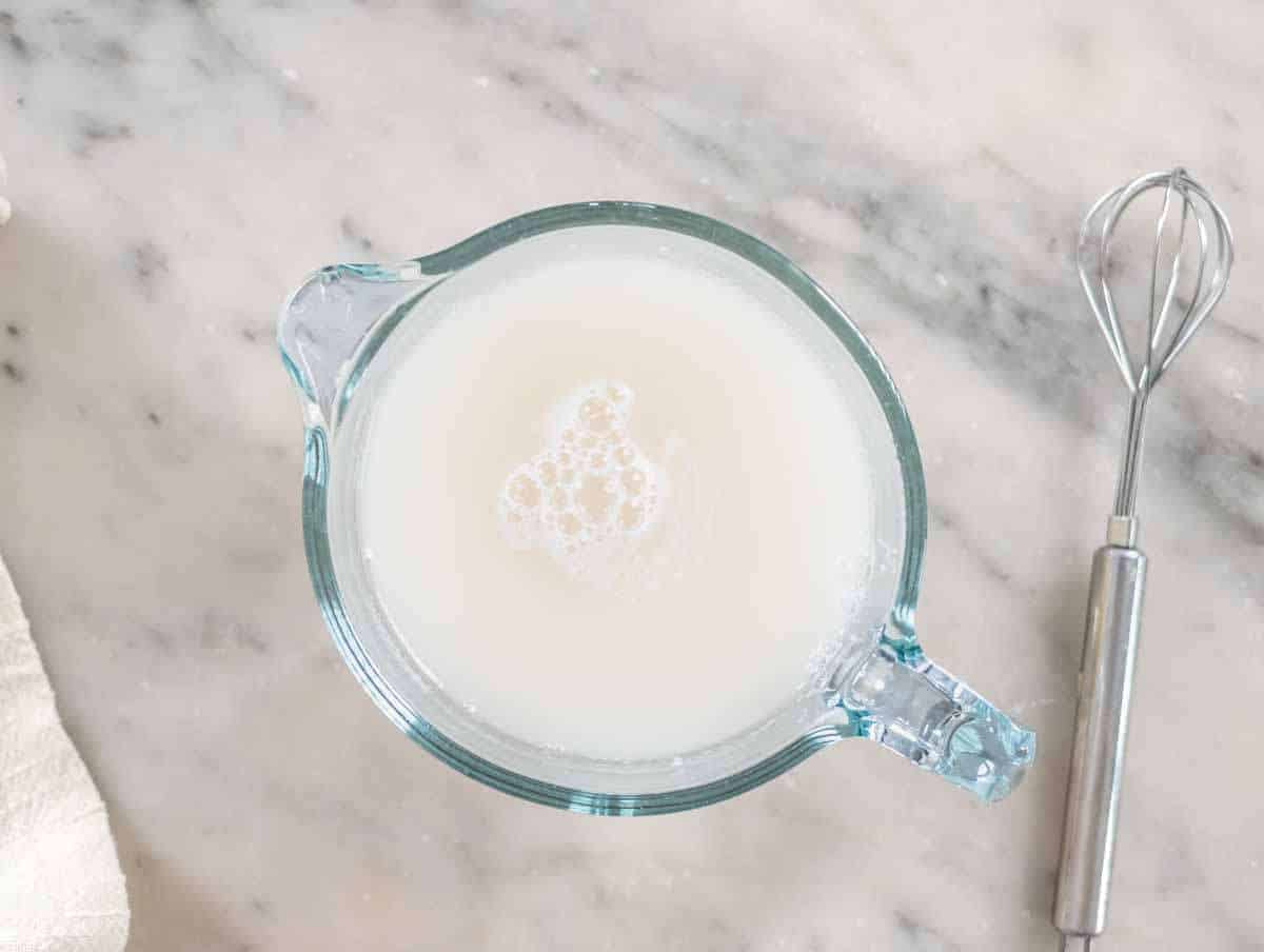 Step 1 Yeast dissolving in warm water with sugar in small bowl before mixing.