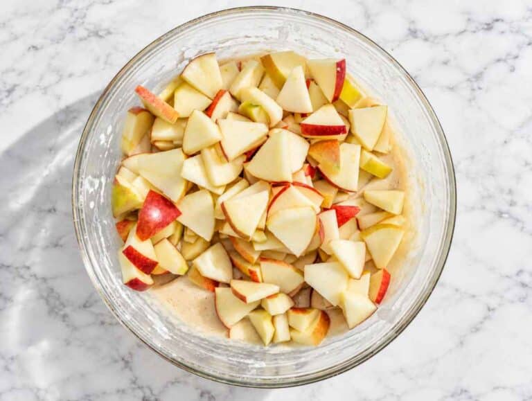 Step 2 Chopped apples folded into thick vegan apple cake batter.