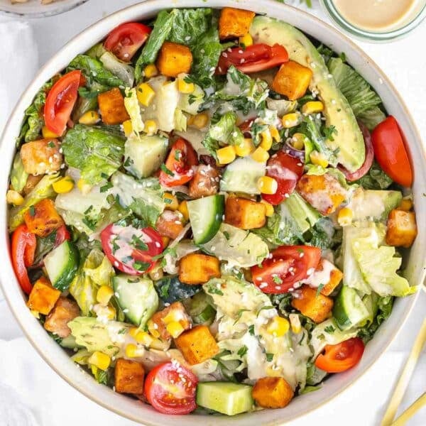 Tofu salad with tahini sauce in a bowl.