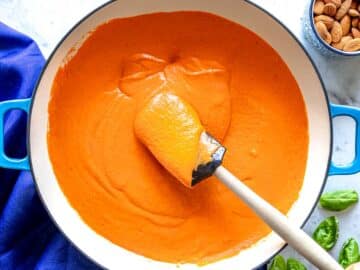 Red pepper sauce in a skillet simmering for 10 minutes.