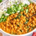 Creamy chickpea curry served with basmati rice, fresh cilantro, and lemon.