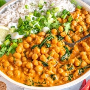 Creamy chickpea curry served with basmati rice, fresh cilantro, and lemon.