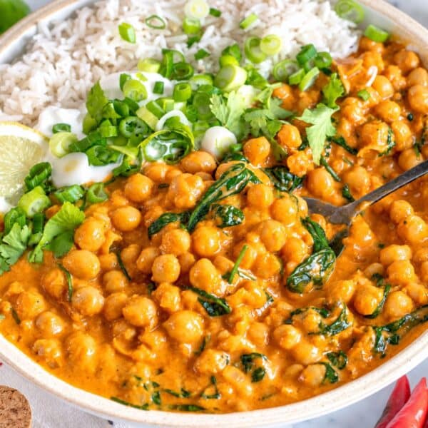 Creamy chickpea curry served with basmati rice, fresh cilantro, and lemon.