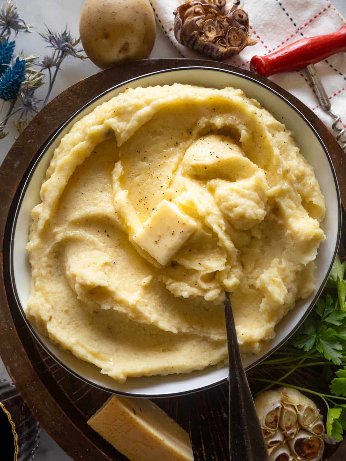 Parmesan mashed potatoes with roasted garlic.