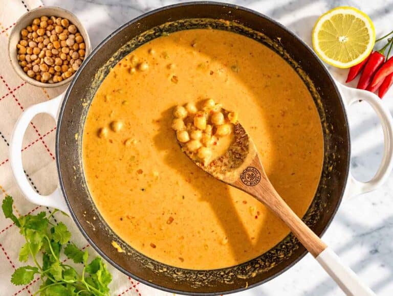 Step 2 Chickpeas stirred into the aromatics with broth, crushed tomatoes, and coconut milk.