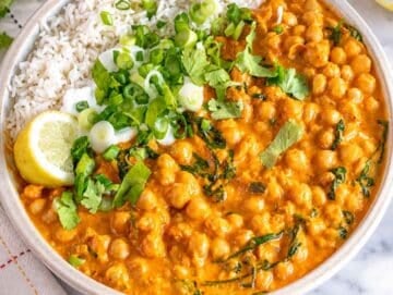 Step 4 Chickpea curry spooned over basmati rice with cilantro, lemon, and yogurt.