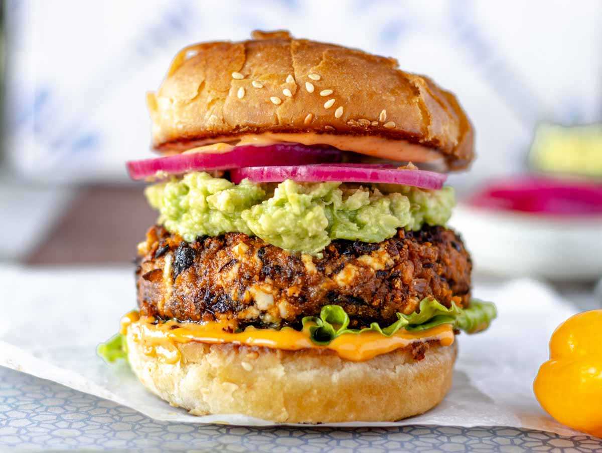 The best black bean burger with guacamole, chipotle sauce, and buttered buns.