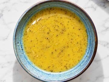Step 1 Olive oil, vinegar, mustard, maple syrup, and oregano whisked together.
