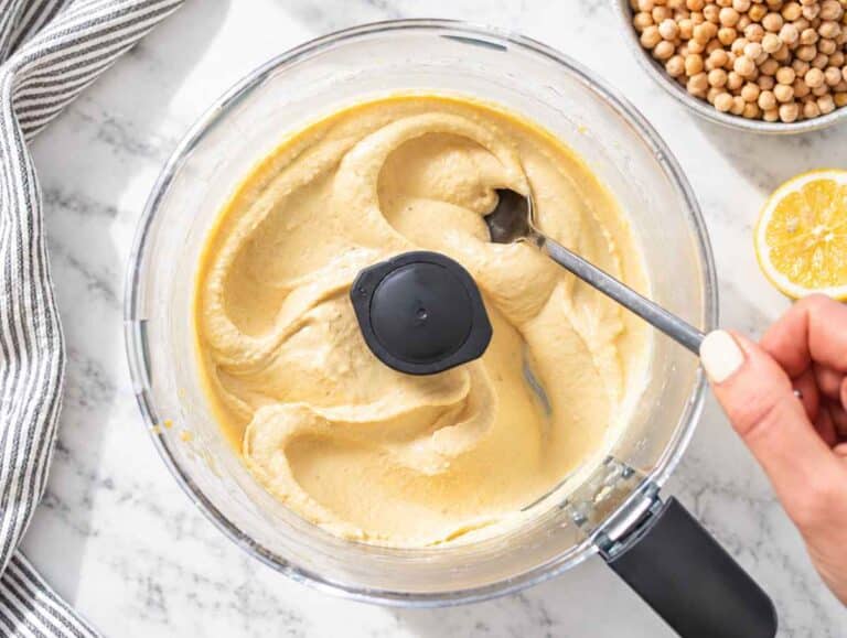 Step 2 Chickpeas, aquafaba, lemon, tahini, and seasonings blended into smooth, creamy hummus.