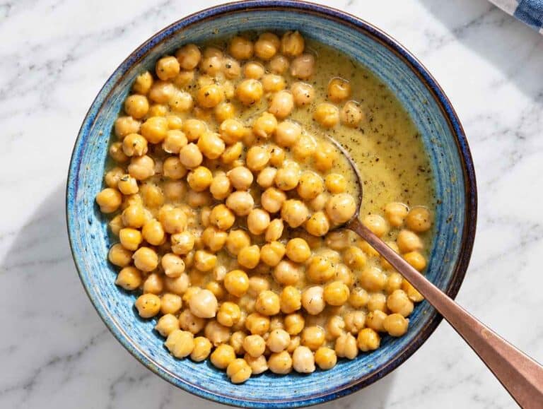 Step 2 Chickpeas tossed with Greek dressing until glossy and evenly coated.