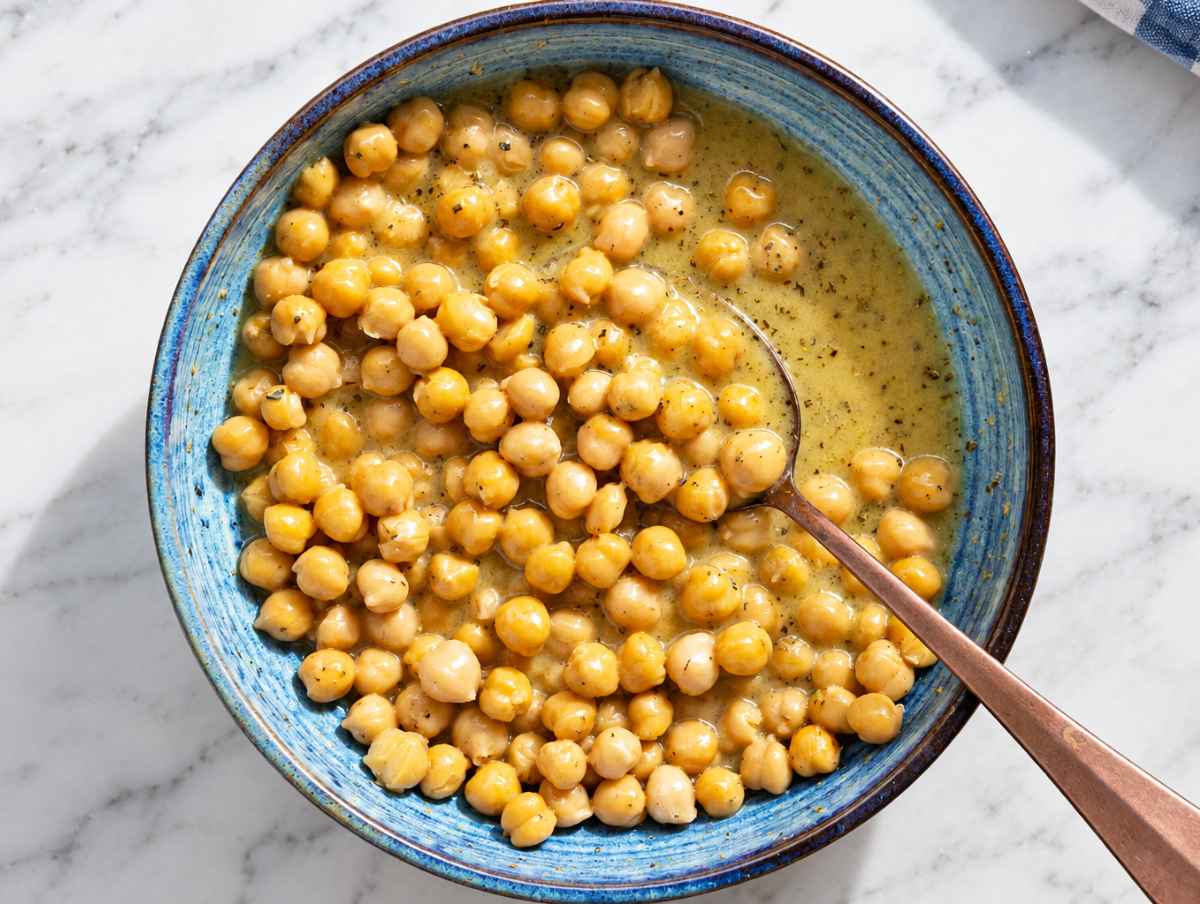 Step 2 Chickpeas tossed with Greek dressing until glossy and evenly coated.