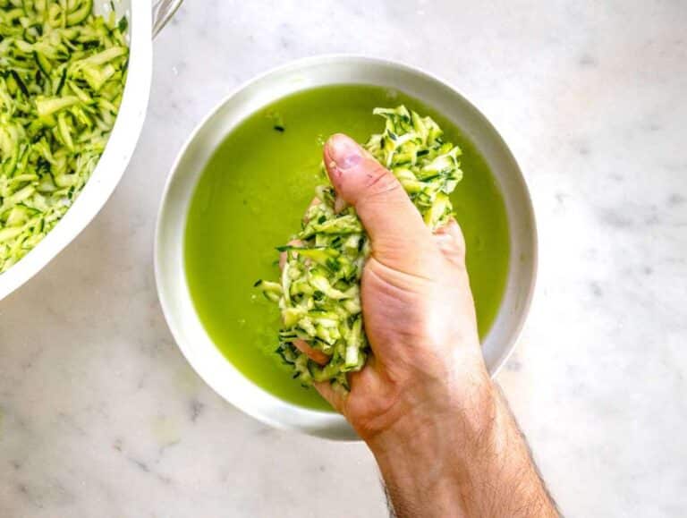 Step 2 Squeezing the water out of the grated zucchini