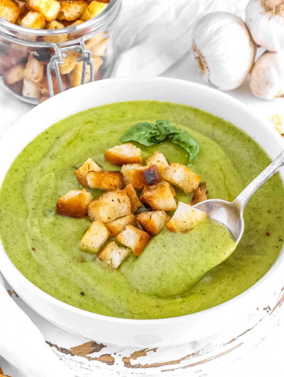 Zucchini soup with homemade croutons.