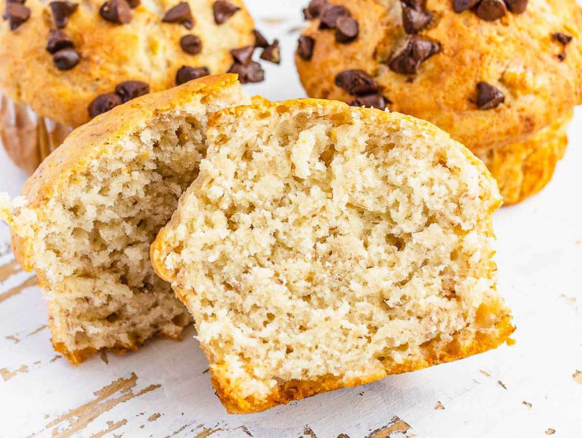 A vegan banana muffin cut open and close up.
