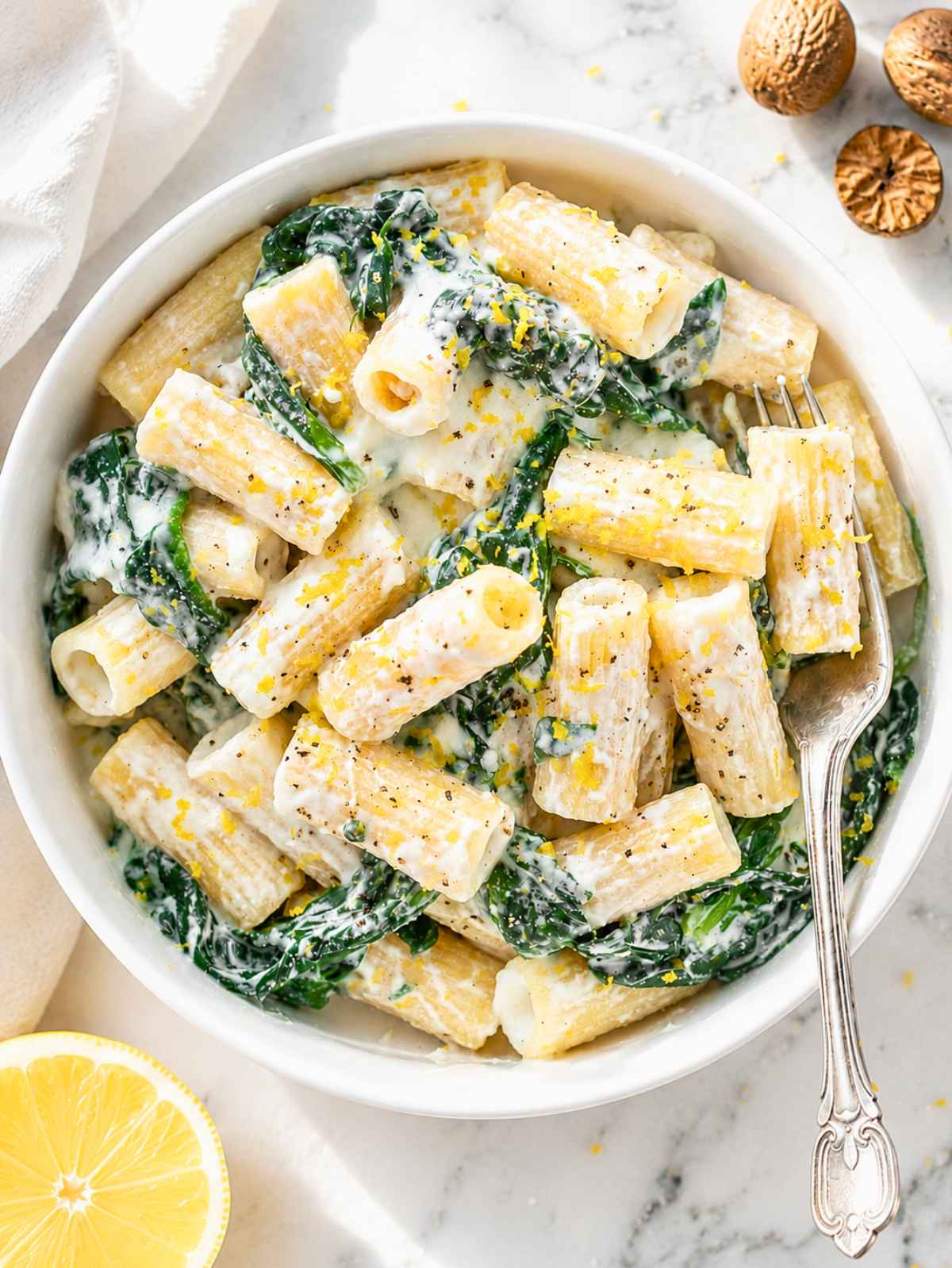 Creamy lemon ricotta pasta with spinach, Parmesan, basil, and lemon zest.