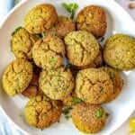Homemade falafel stacked on a plate