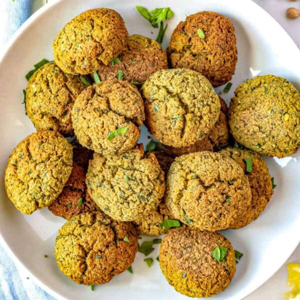 Homemade falafel stacked on a plate