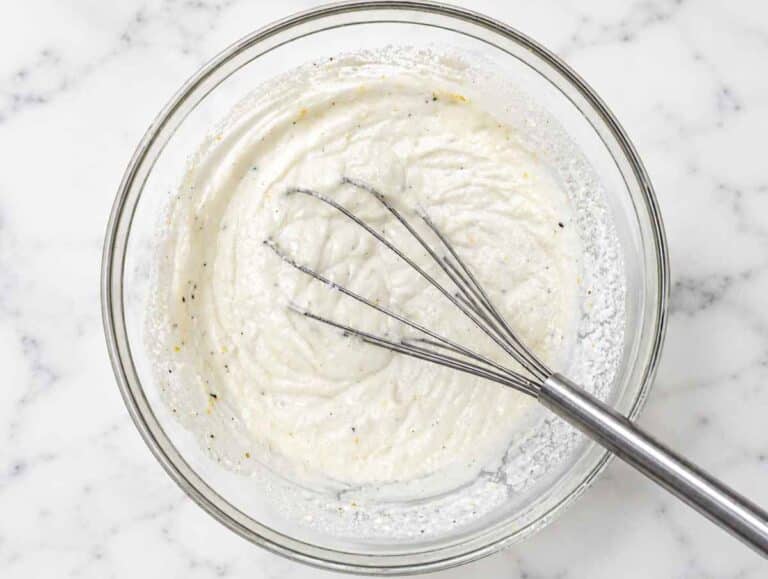 Step 2 Ricotta, Parmesan, lemon zest, and pasta water whisked into creamy sauce.