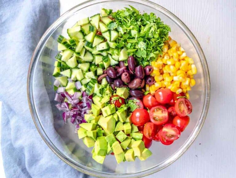 Step 3 Chopped tomatoes, cucumber, corn, olives, onion, parsley, and avocado.