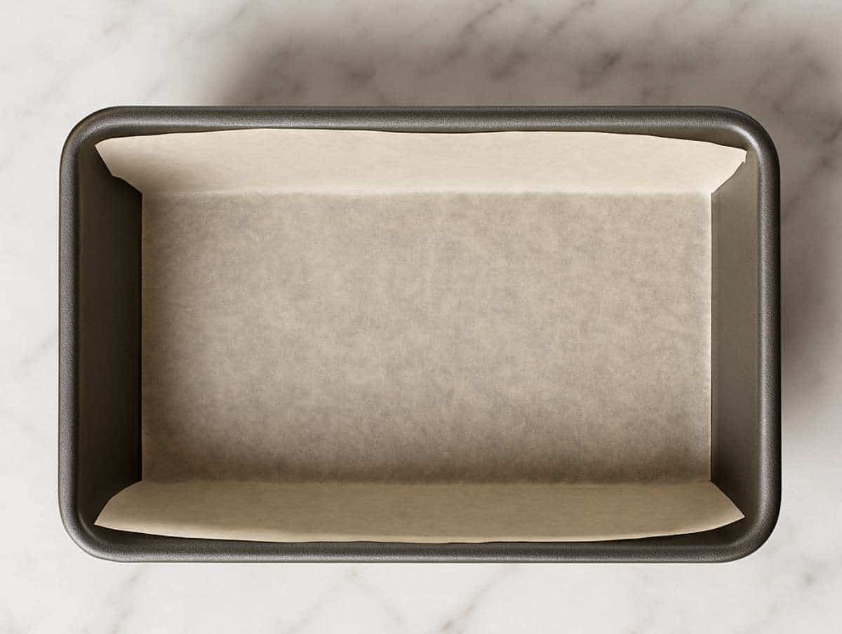 Step picture 1 Loaf pan lined with parchment paper.