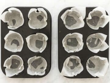 Two six-muffin tins lined with muffin liners