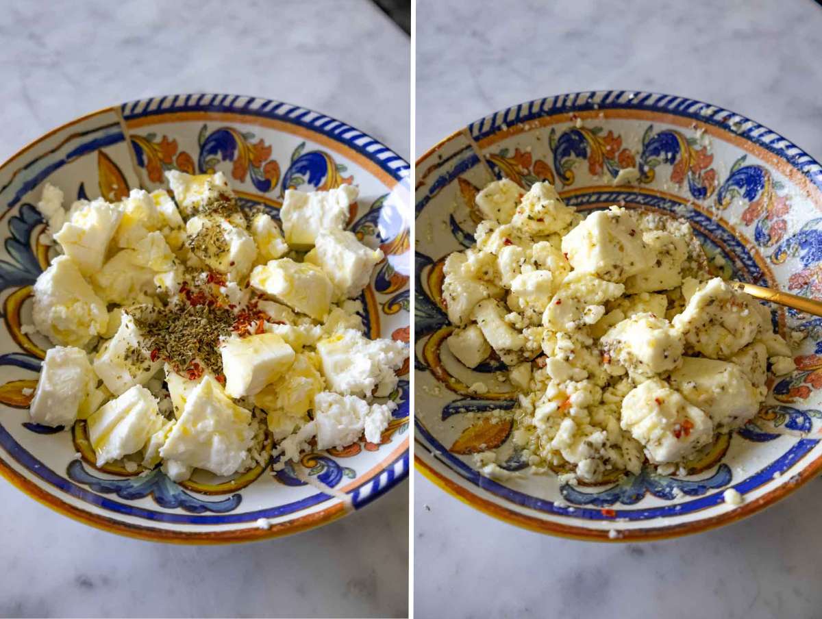 Chunks of feta marinated with olive oil, oregano, honey, and red pepper flakes in a bowl.