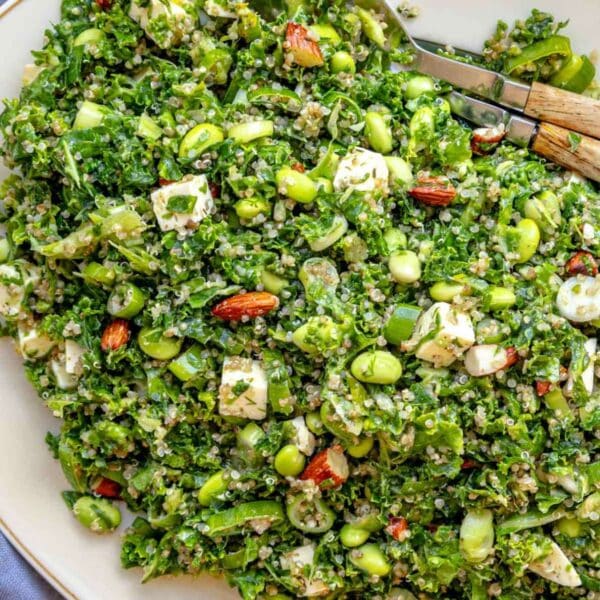 Colorful kale quinoa salad with feta and lemon dressing, a high-protein vegetarian recipe.