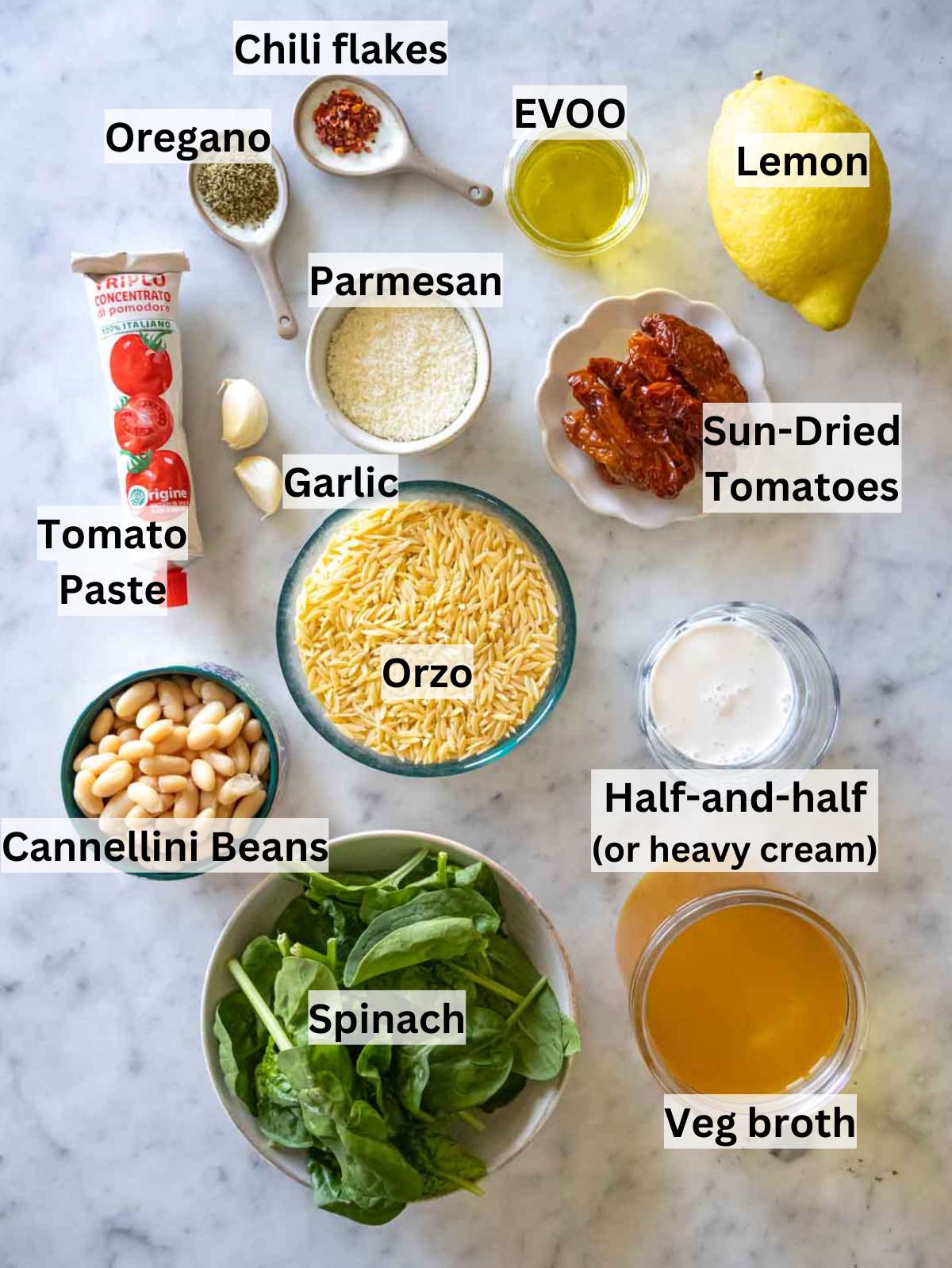 Ingredients for Marry Me Orzo laid out on counter, including orzo, beans, and spinach.
