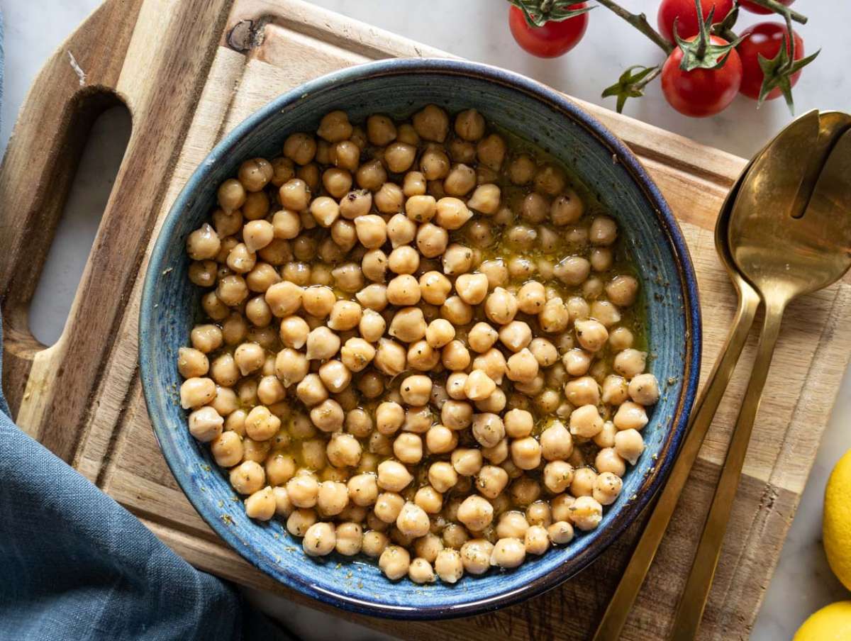 Step 3 - Chickpeas soaking in dressing for extra flavor in Mediterranean chopped salad.