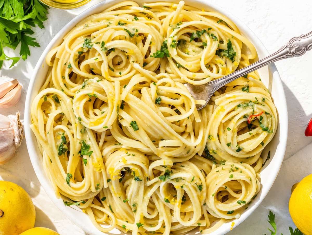 Step 4 Parsley and parmesan folded into Lemon Pasta before serving immediately.