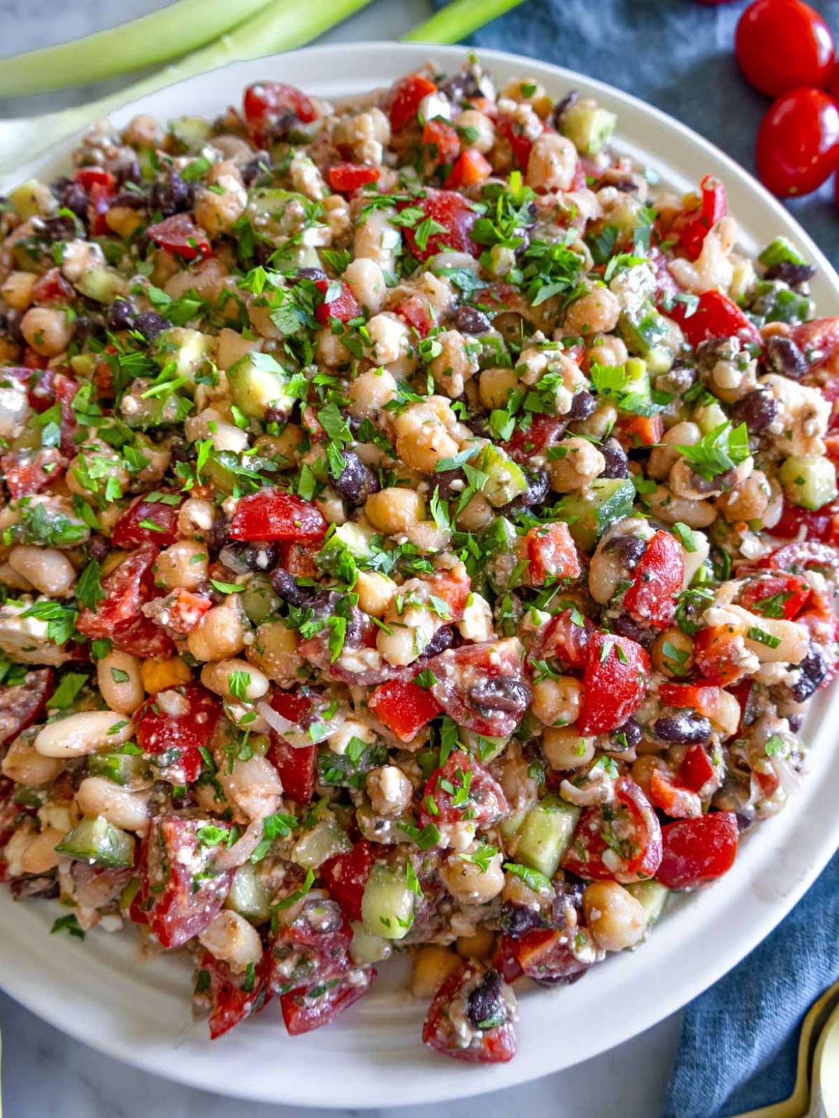 Close up of high protein bean salad with colorful vegetables and feta cheese