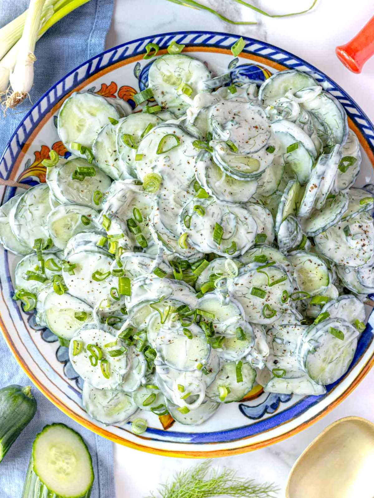Creamy cucumber salad with Greek yogurt served in a bowl with fresh dill garnish.