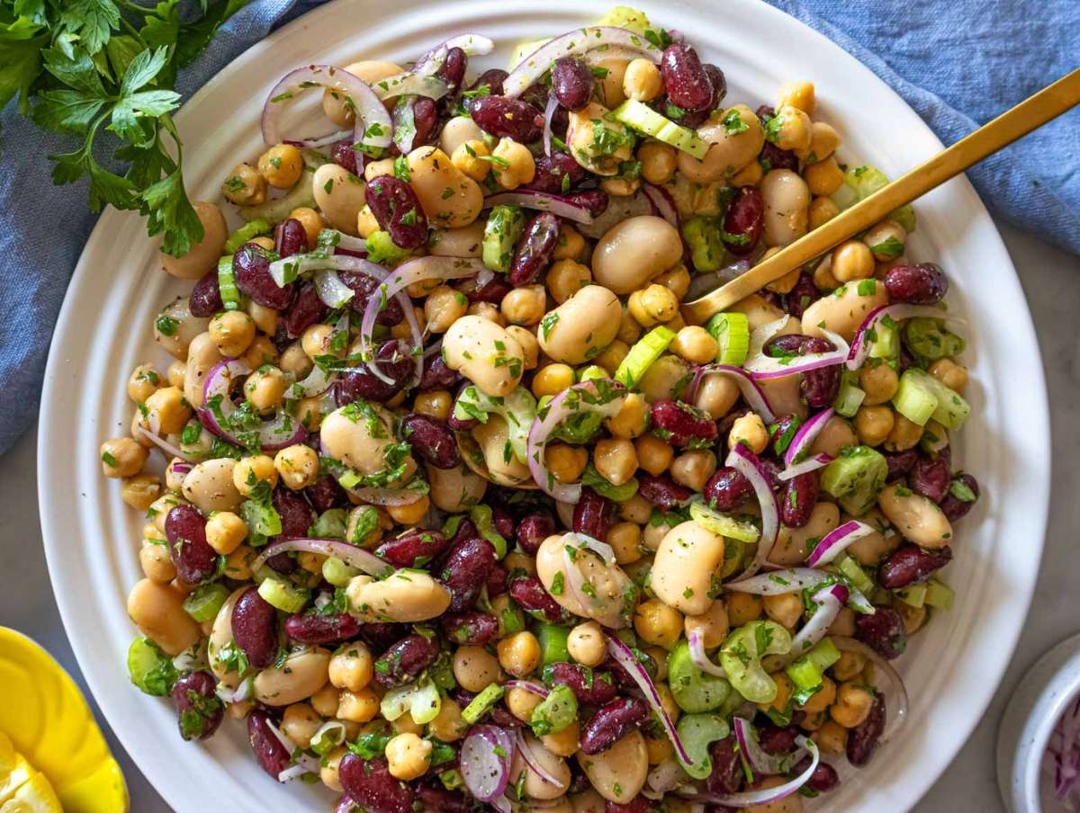 Step 3 Finished 3 bean salad recipe chilling in bowl ready to serve with parsley.