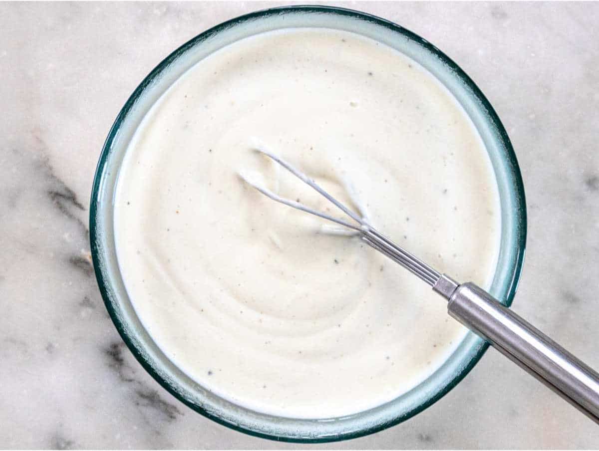 Greek yogurt dressing mixed in a small bowl.
