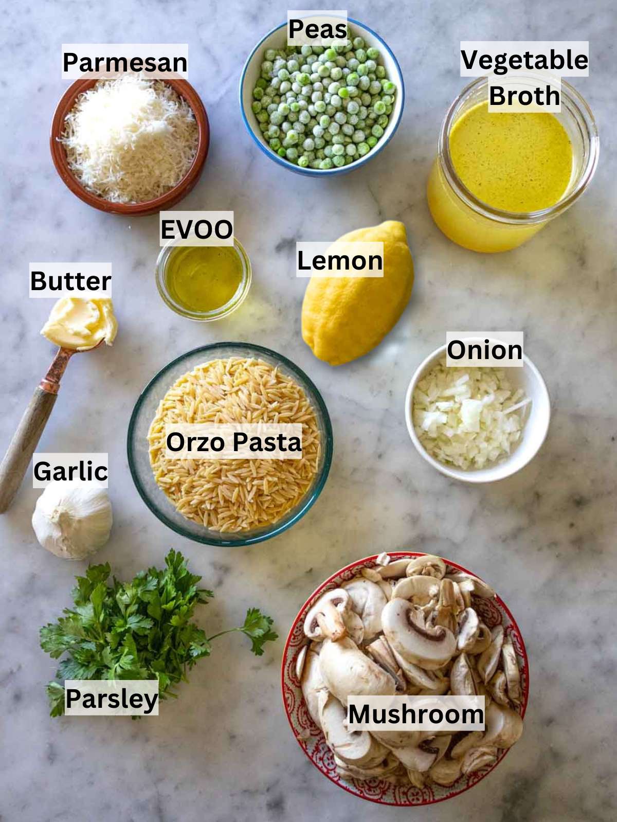 Ingredients for mushroom orzo recipe including orzo pasta mushrooms peas parmesan and broth.