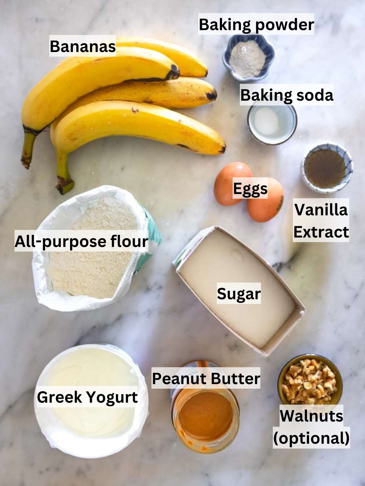 Ingredients for protein banana bread with ripe bananas Greek yogurt peanut butter and flour.