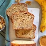 Protein banana bread loaf on a marble board ready for breakfast or snack.