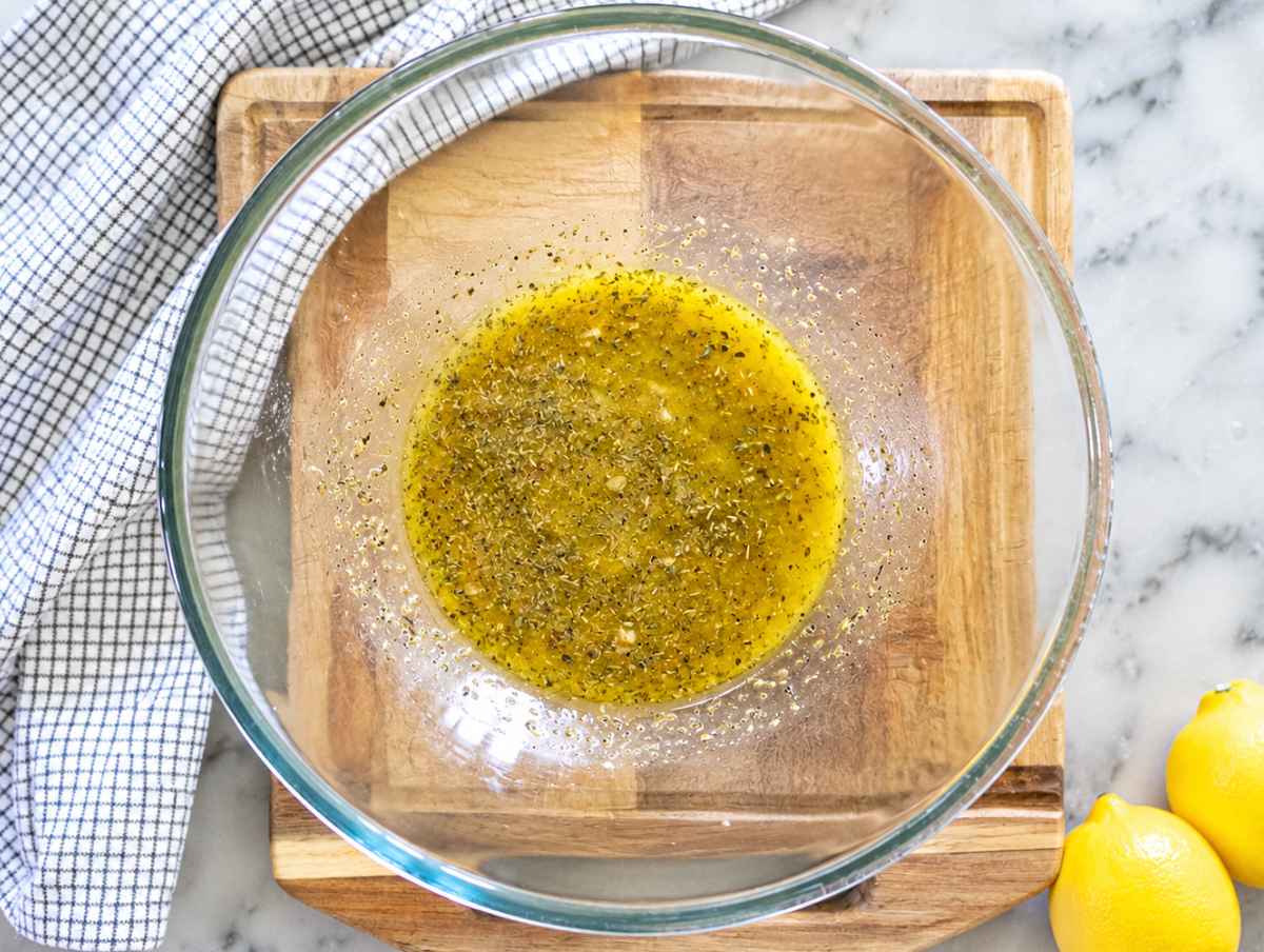 Step 1 Lemon vinaigrette whisked with olive oil, vinegar, oregano, honey, and mustard.
