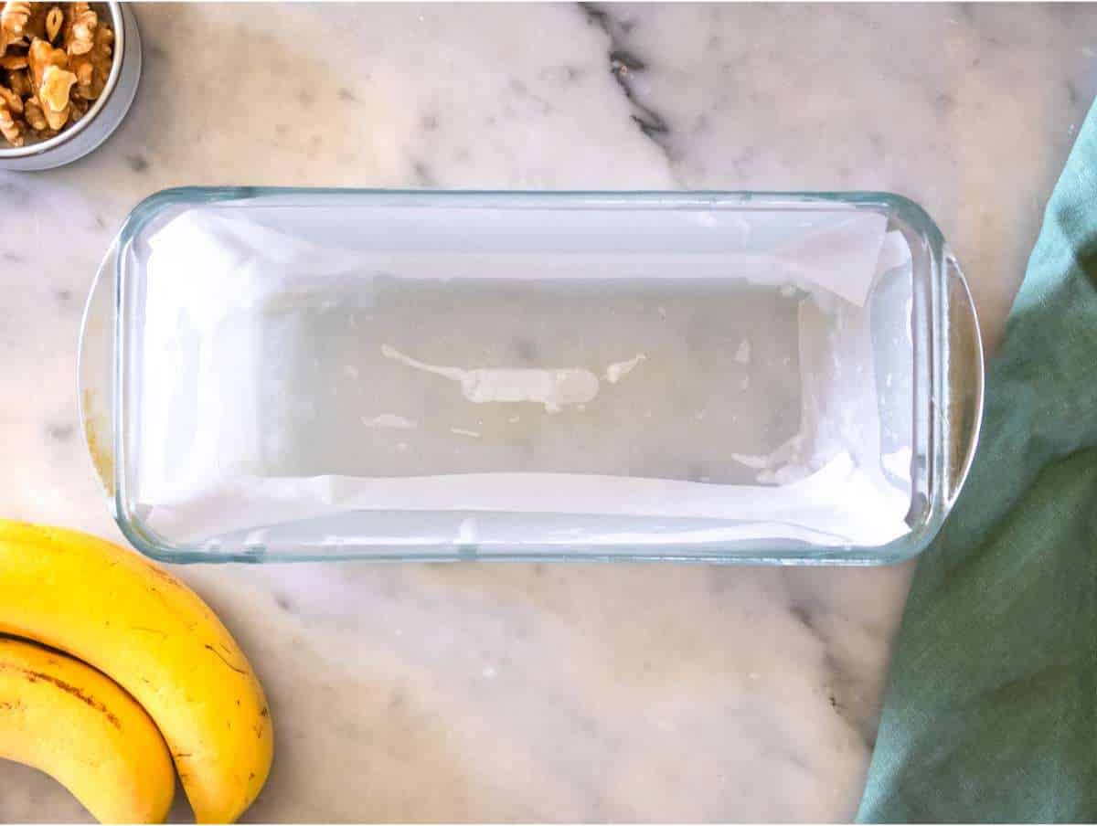 Step 1 Lined loaf pan ready for baking protein banana bread.