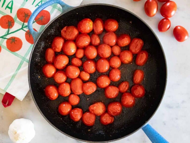 Step 1 Tomatoes blistering in skillet for cherry tomato orzo recipe.