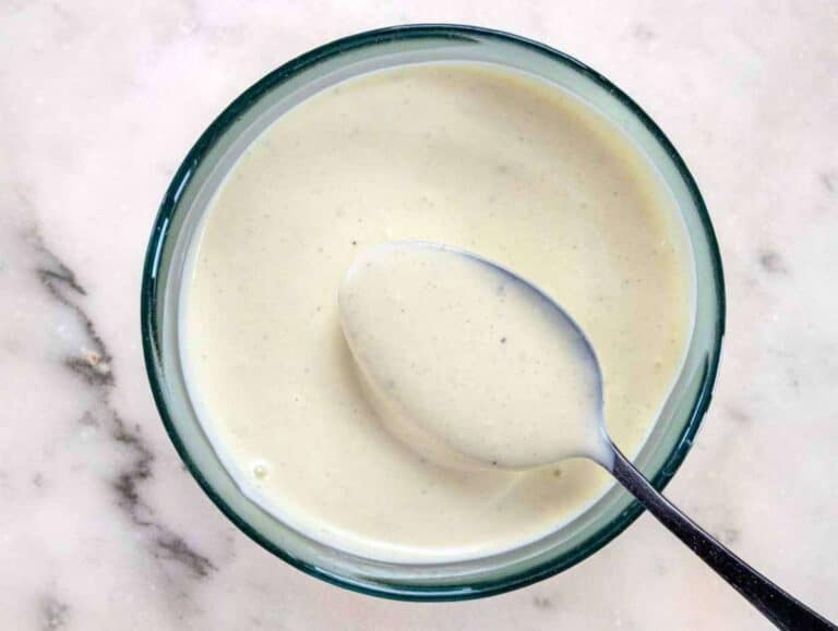 Step 1 Whisking Greek yogurt mayo mustard honey and vinegar for creamy salad dressing.