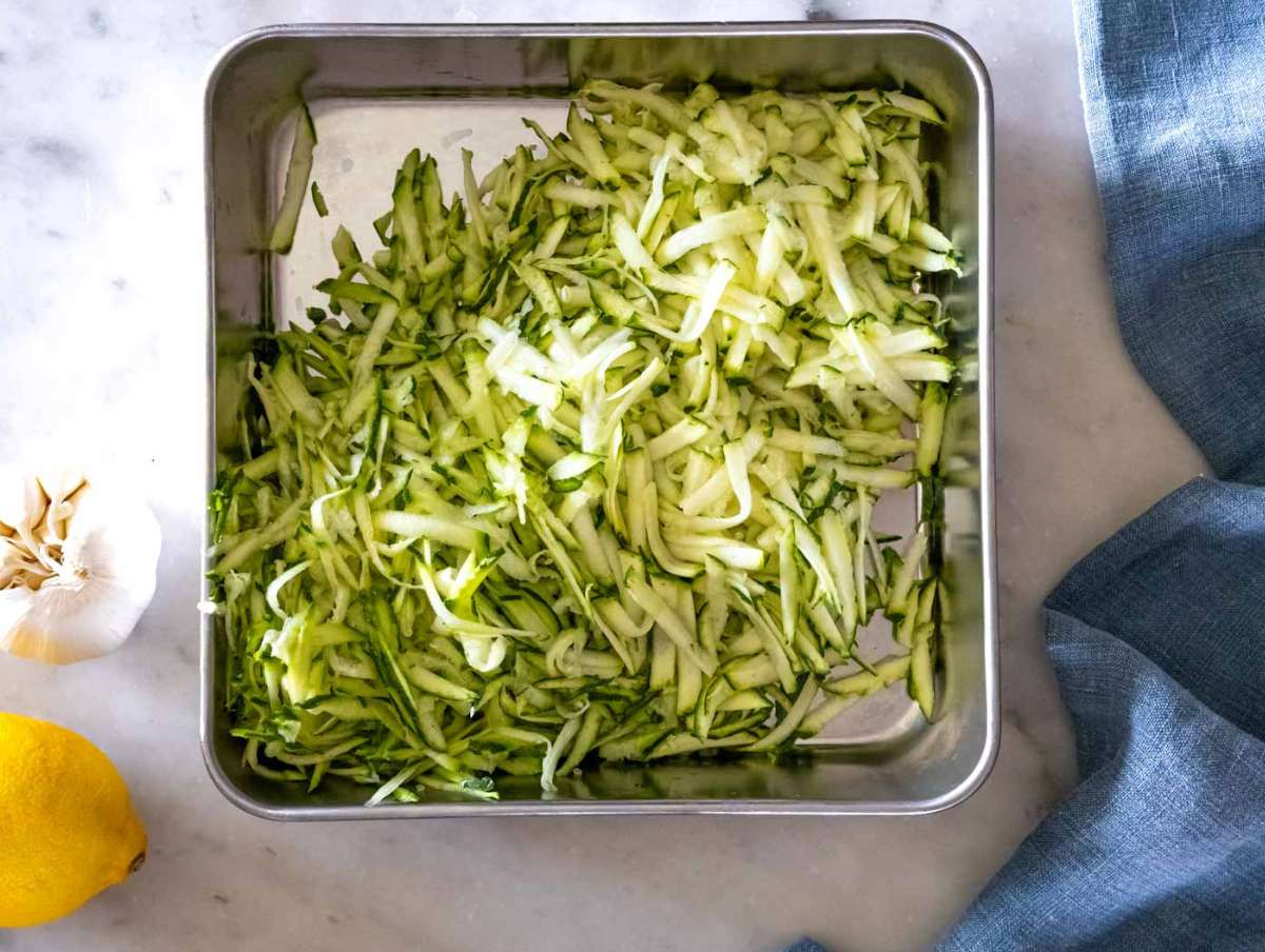 Step 1 Zucchini grated with the large holes of a box grater.