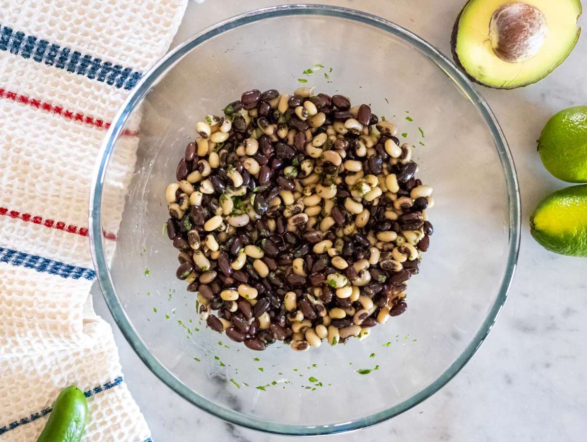 Step 2 Black beans and black eyed peas marinating in Cowboy Caviar dressing for flavor.