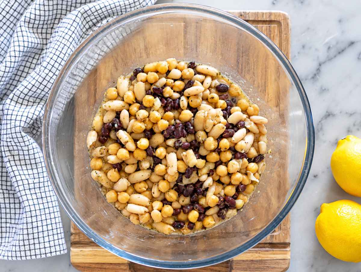 Step 2 Chickpeas, black beans, and cannellini beans marinating in lemon vinaigrette.